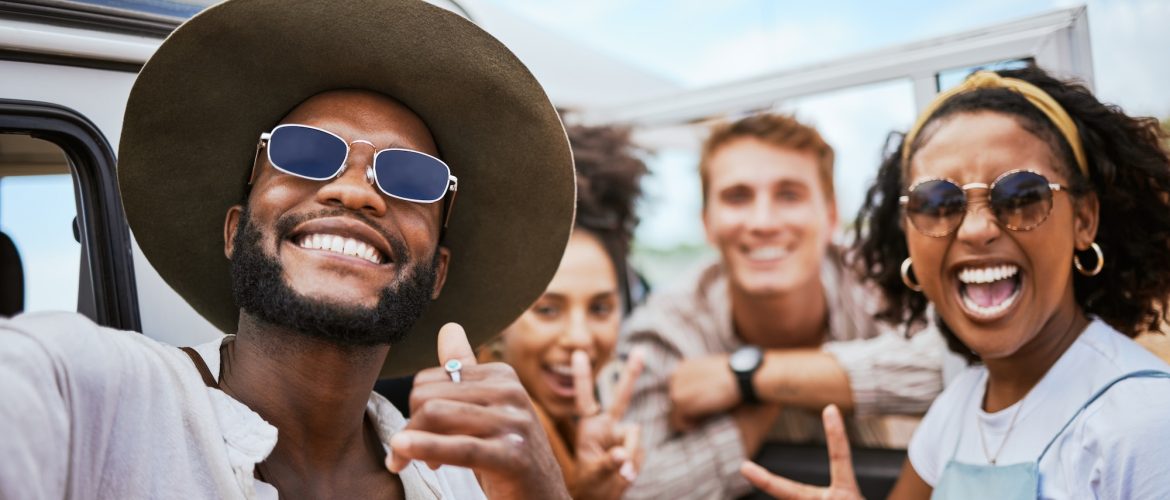 Travel, adventure and selfie with friends celebrating freedom and showing hand peace sign outdoors.